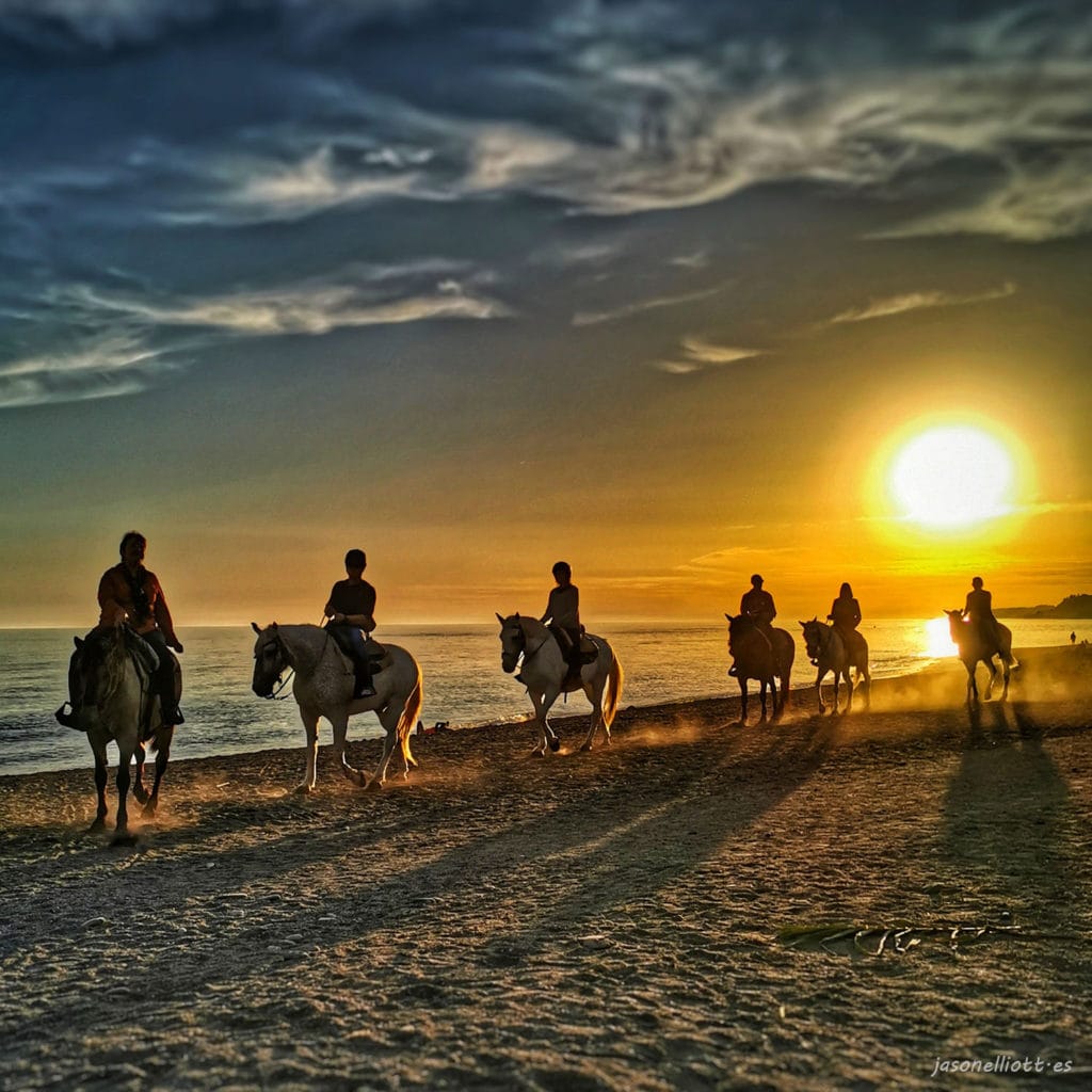 Horse riding on the beach at Nerja as the sun sets on a glorious day