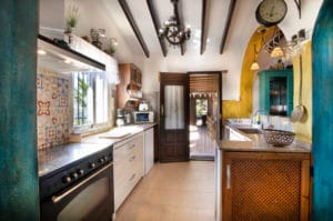 This kitchen is connected to every part of the house and is its heart